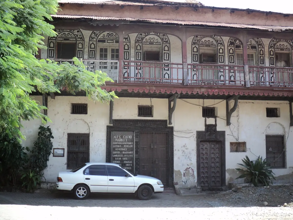 A building with a carved balcony in Mombasa's Old Town